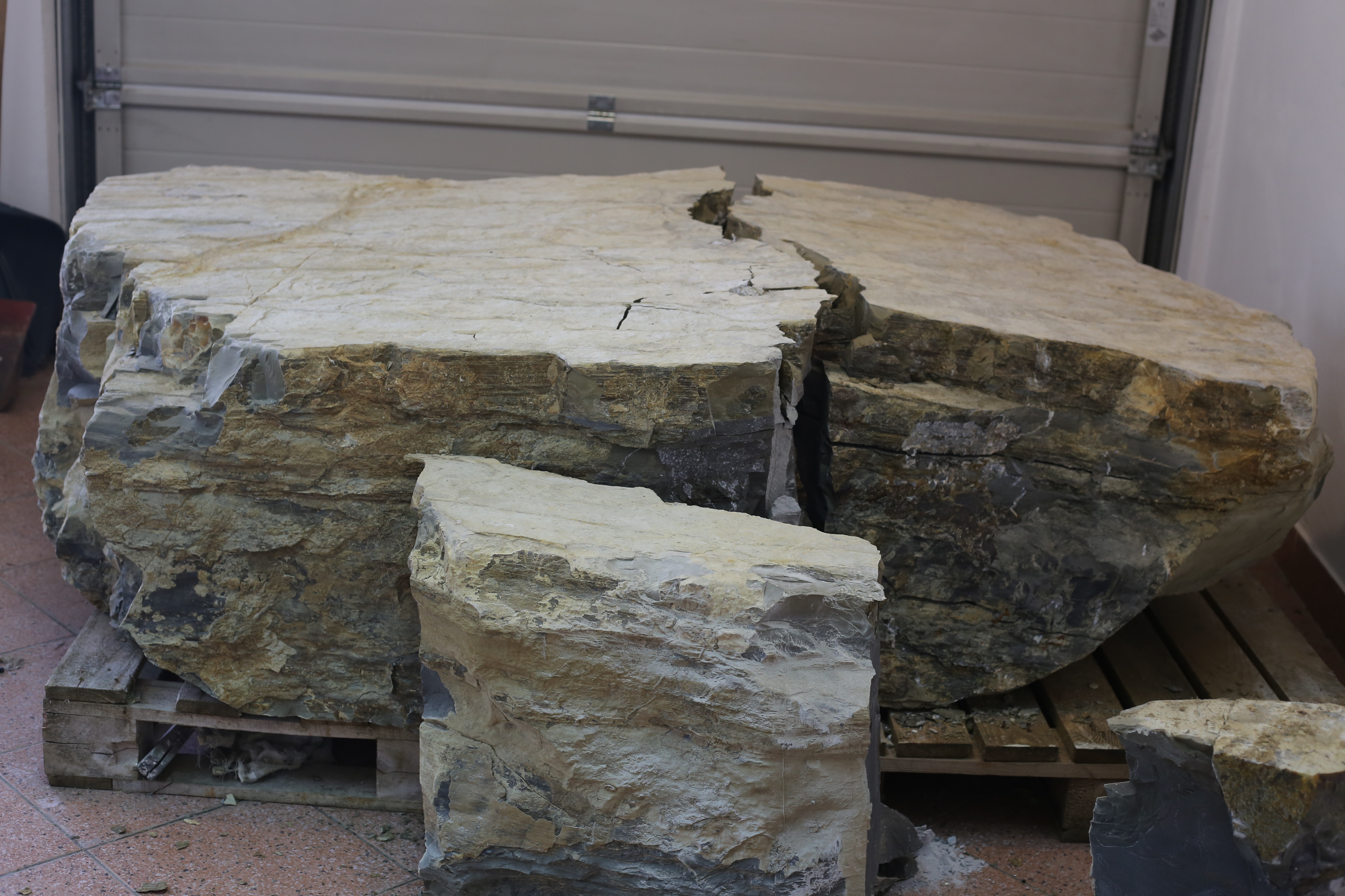 Large natural rock divided into two sections after primary splitting with FRAKTUREX
